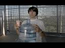 Clearification showing Demetri Martin holding popcorns and bottle of water
